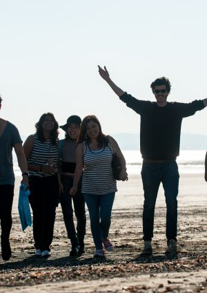 Students celebrating on the beach